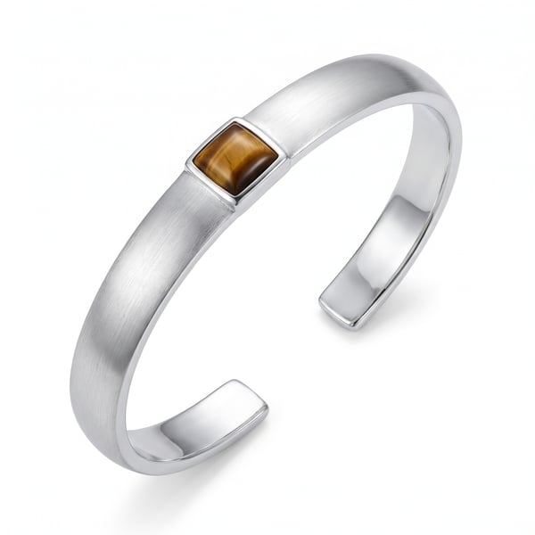 Studio shot of the Younis sterling silver open cuff bracelet with a flush-set square Tiger Eye stone on a plain white background.