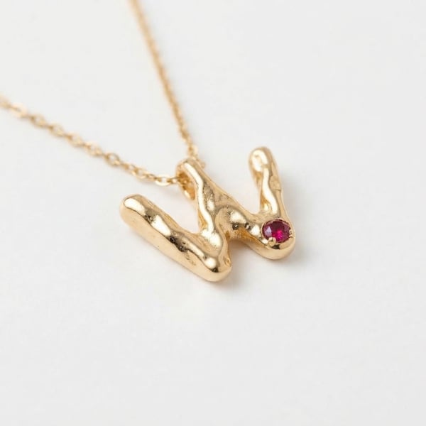 Three-quarter view — Nusrat Initial W 18K Gold Ruby Necklace
