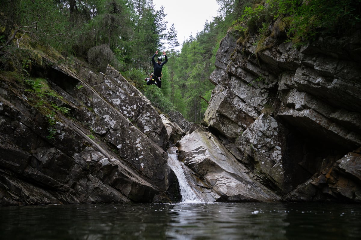 Jumping cannoneer in all action adventure, Bruar canyoning near Pitlochry in Scotland