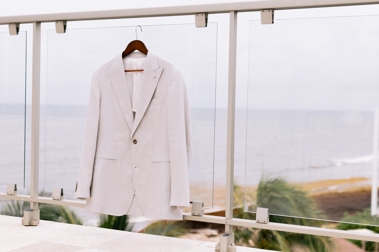 Hussain&rsquo;s linen suit hanging on the balcony rail above the Riviera Maya