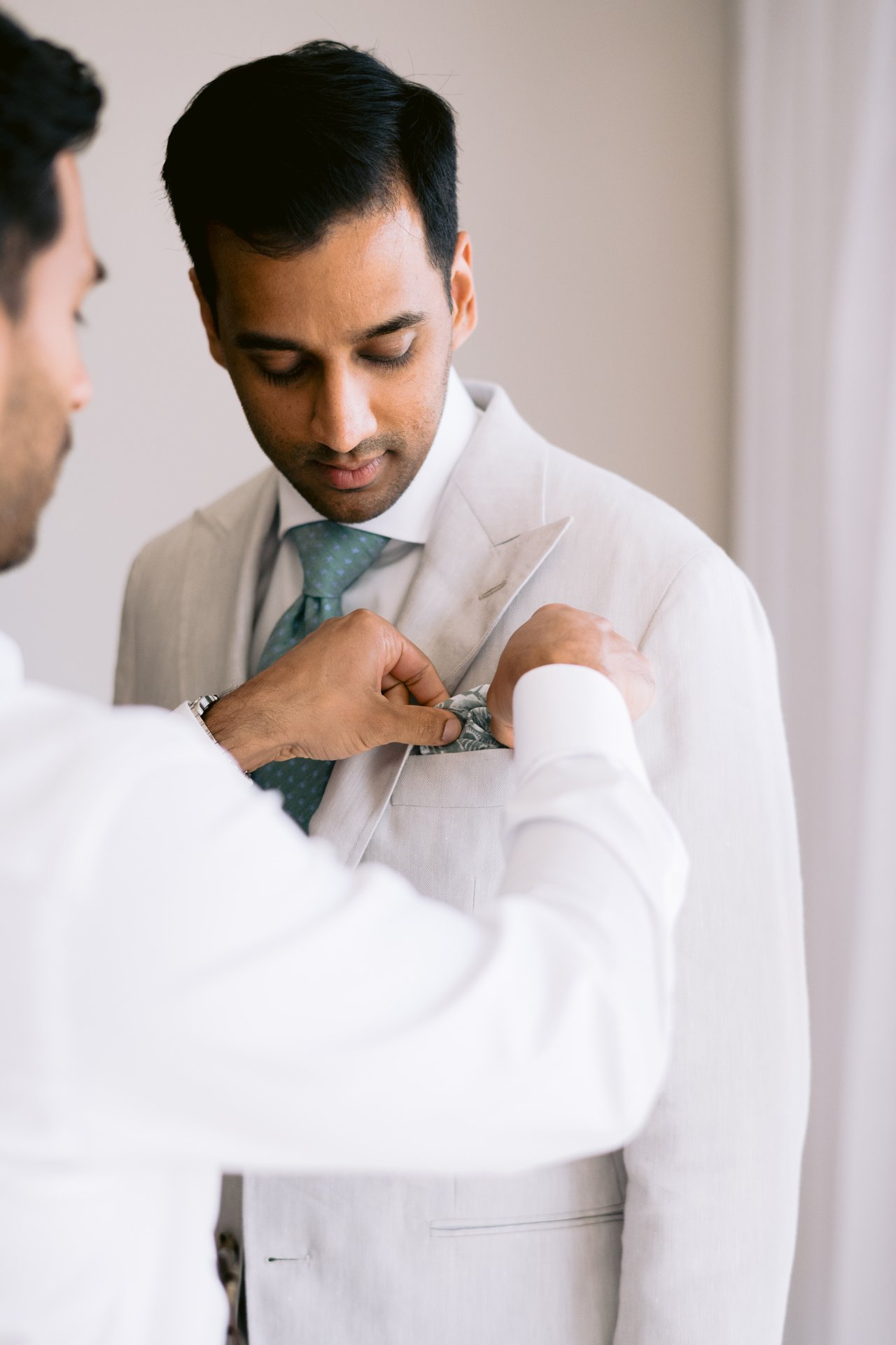 Pinning the baby&rsquo;s-breath boutonniere