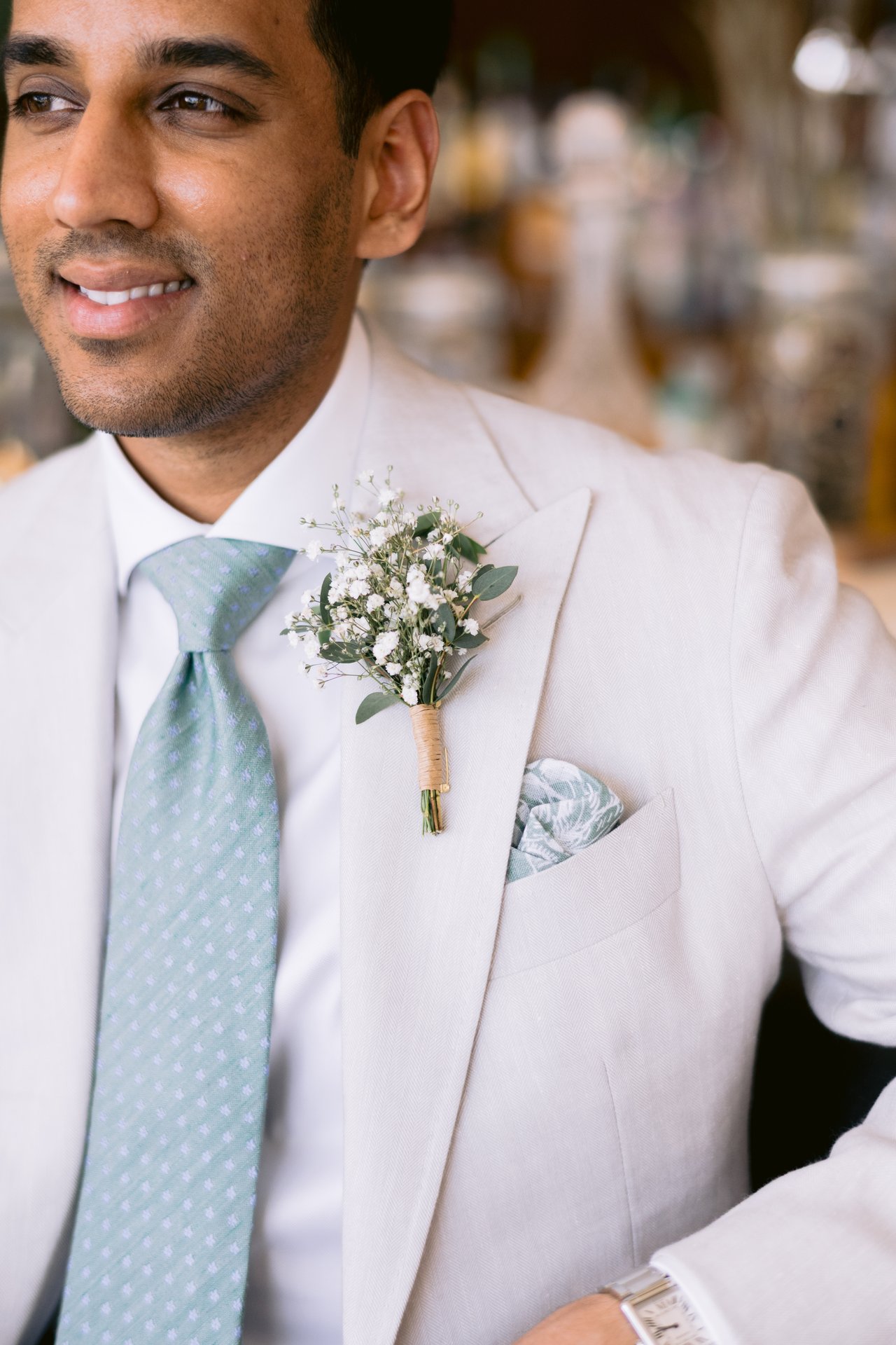 The boutonniere and sage tie, up close