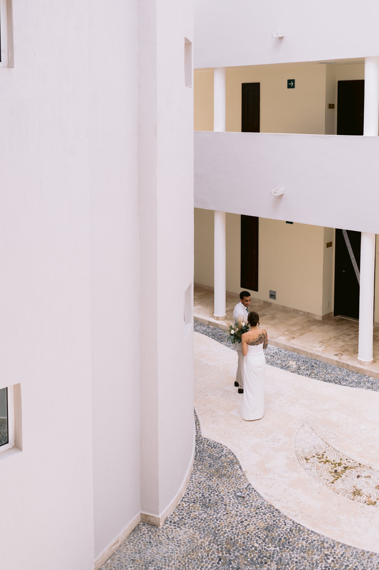 The first look &mdash; Hussain turning to see Iris in the courtyard below