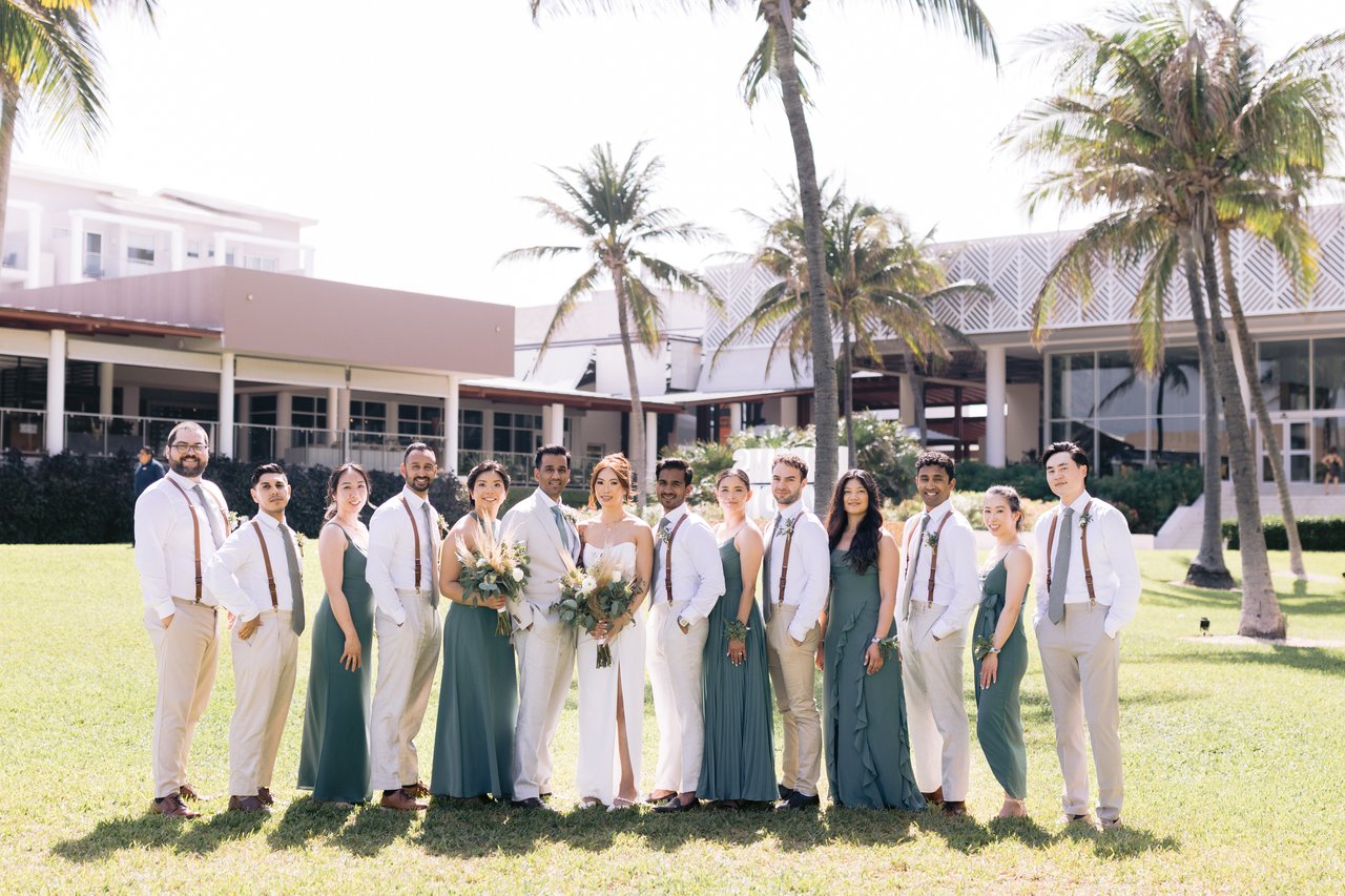 The full wedding party on the lawn at Dreams Jade