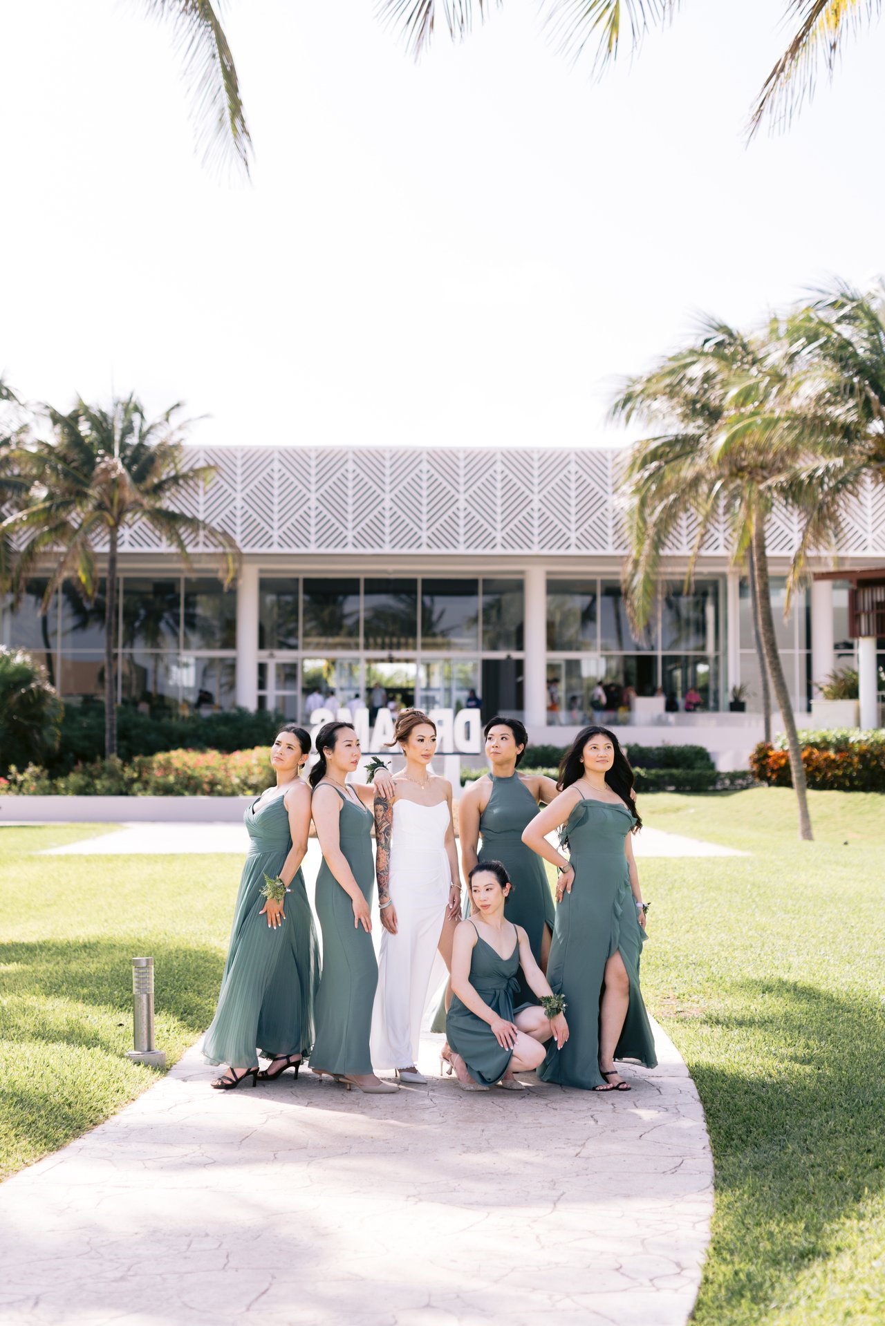 The bridesmaids crossing the lawn