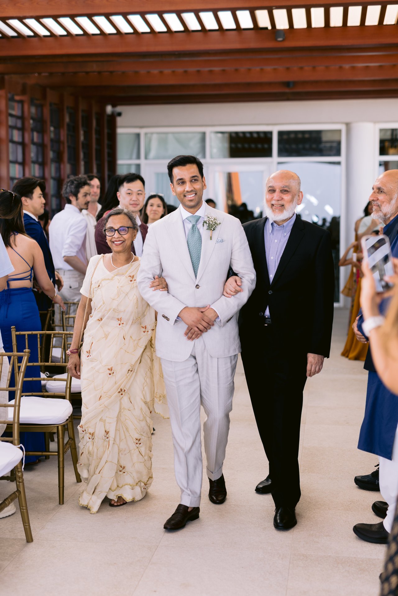 Hussain walking in with his parents