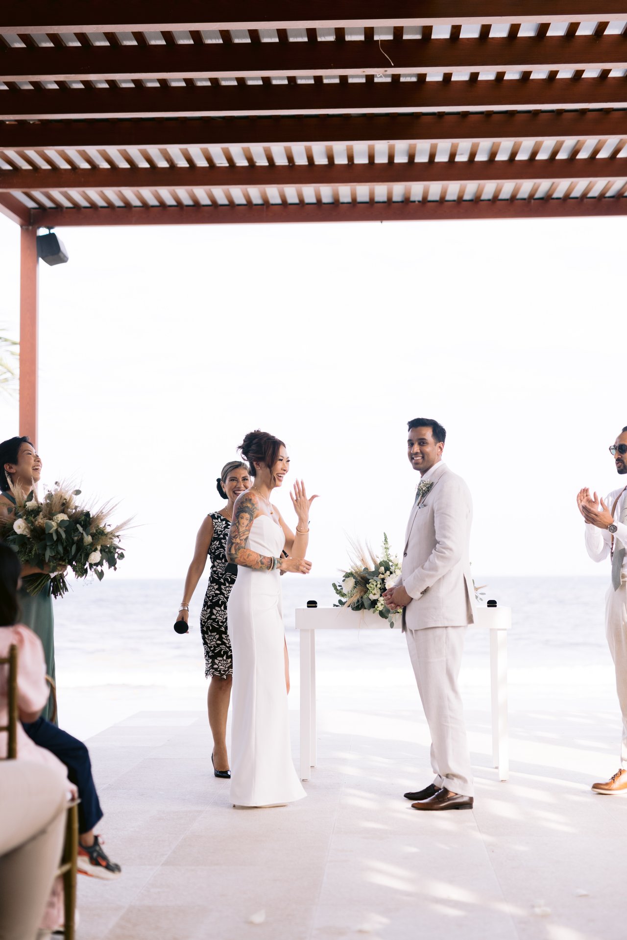 During the ceremony, the ocean behind
