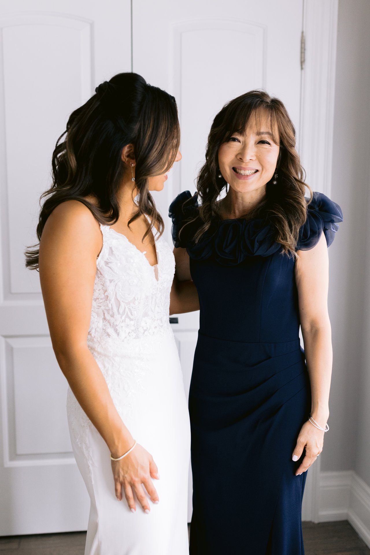 Midori and her mother holding each other before the dress goes on