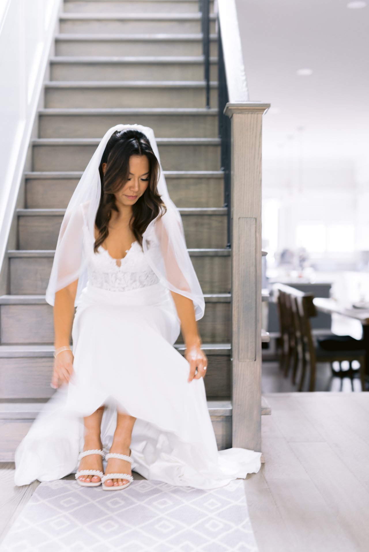 Midori on the staircase in her gown and veil