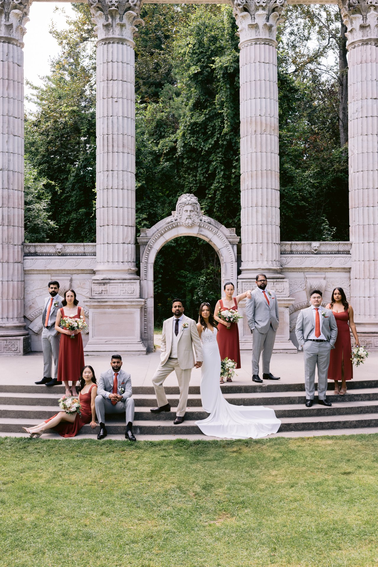 The wedding party gathered at the Guildwood Park stone arch