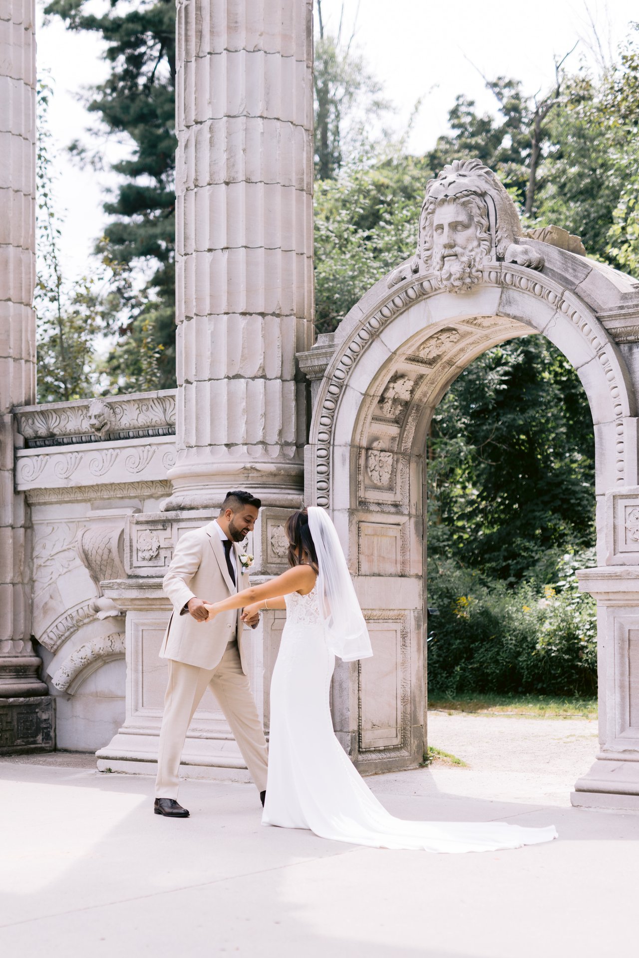 Midori and Adil at the stone arch in Guildwood Park