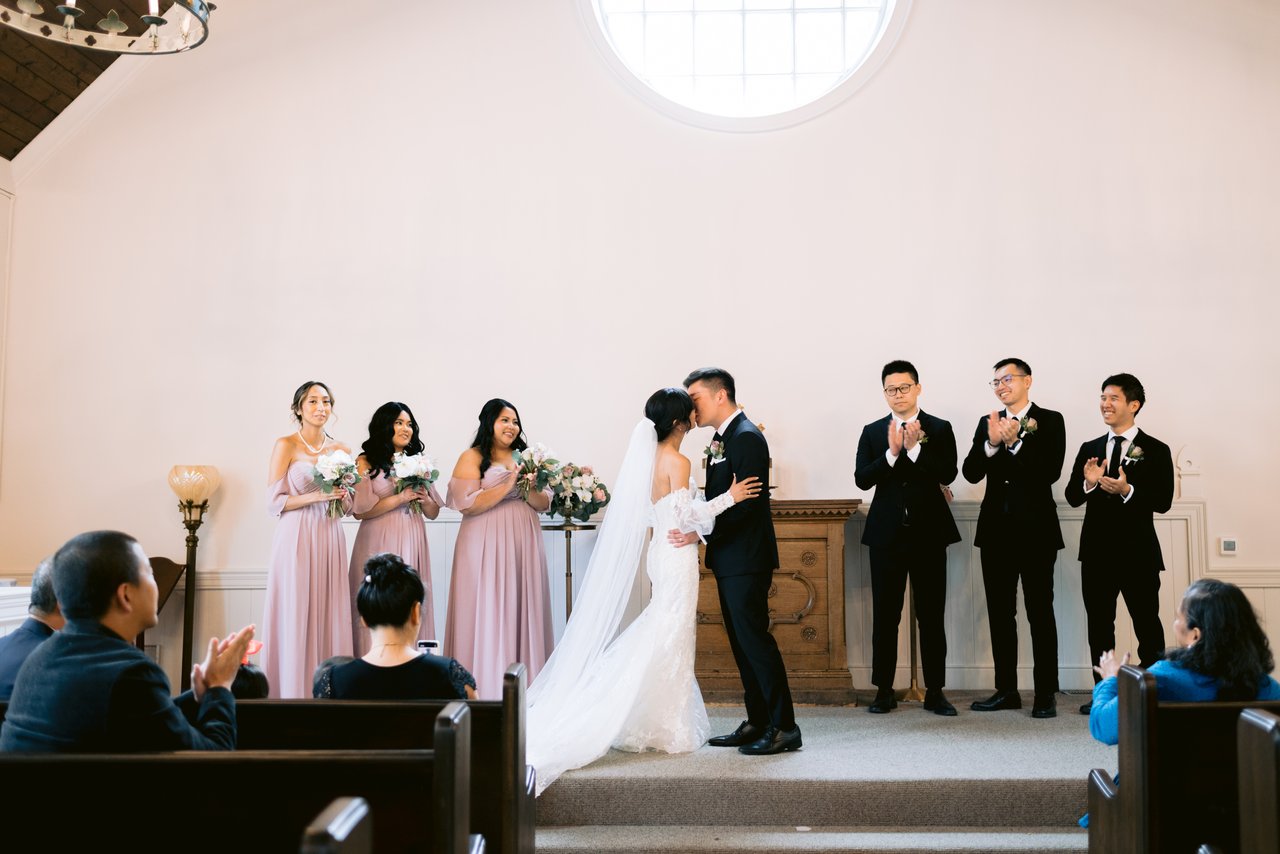 The chapel full, dusty pink in the pews