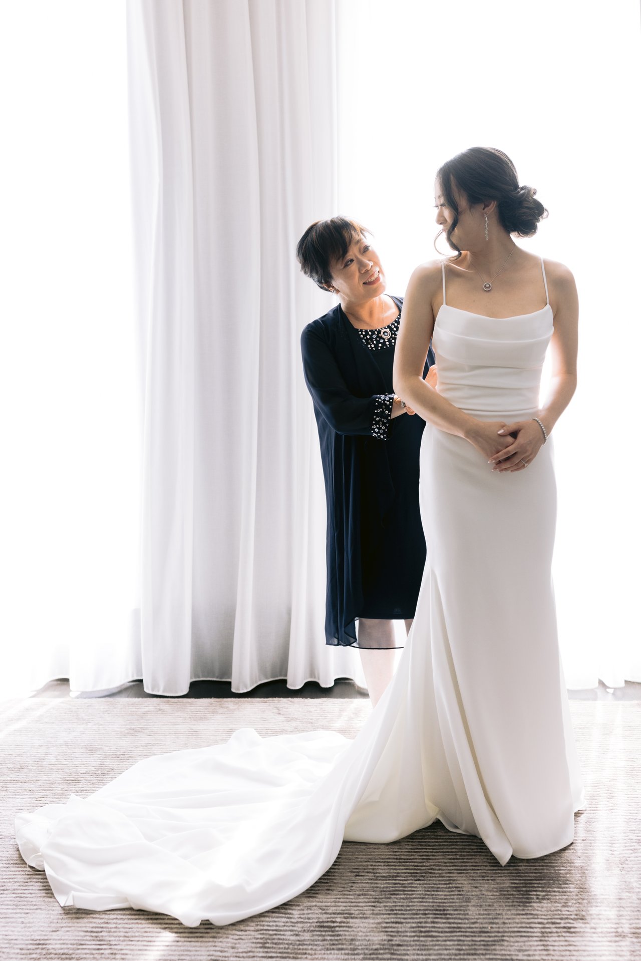 Katie being laced into her gown