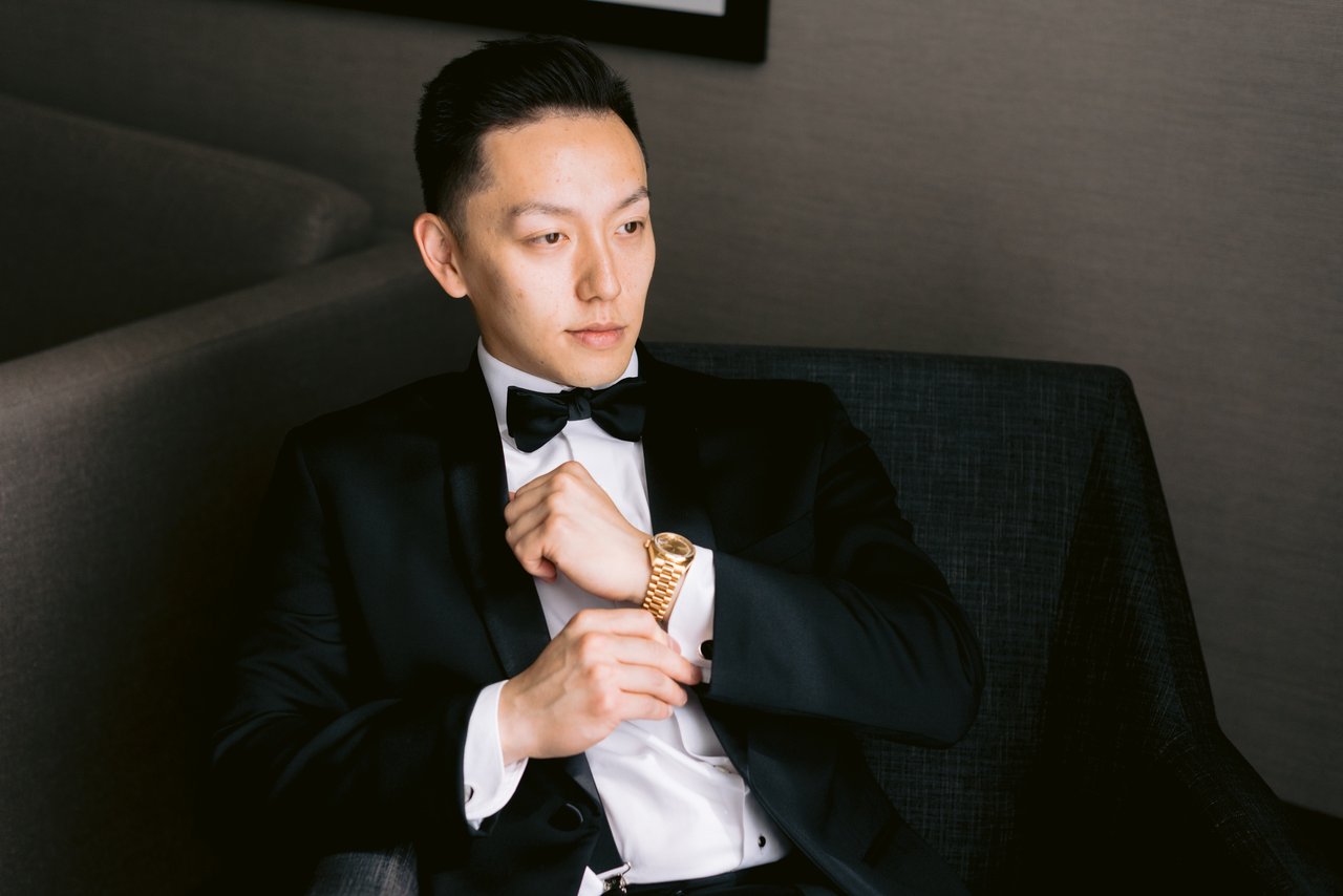 Harry seated, boutonniere in hand