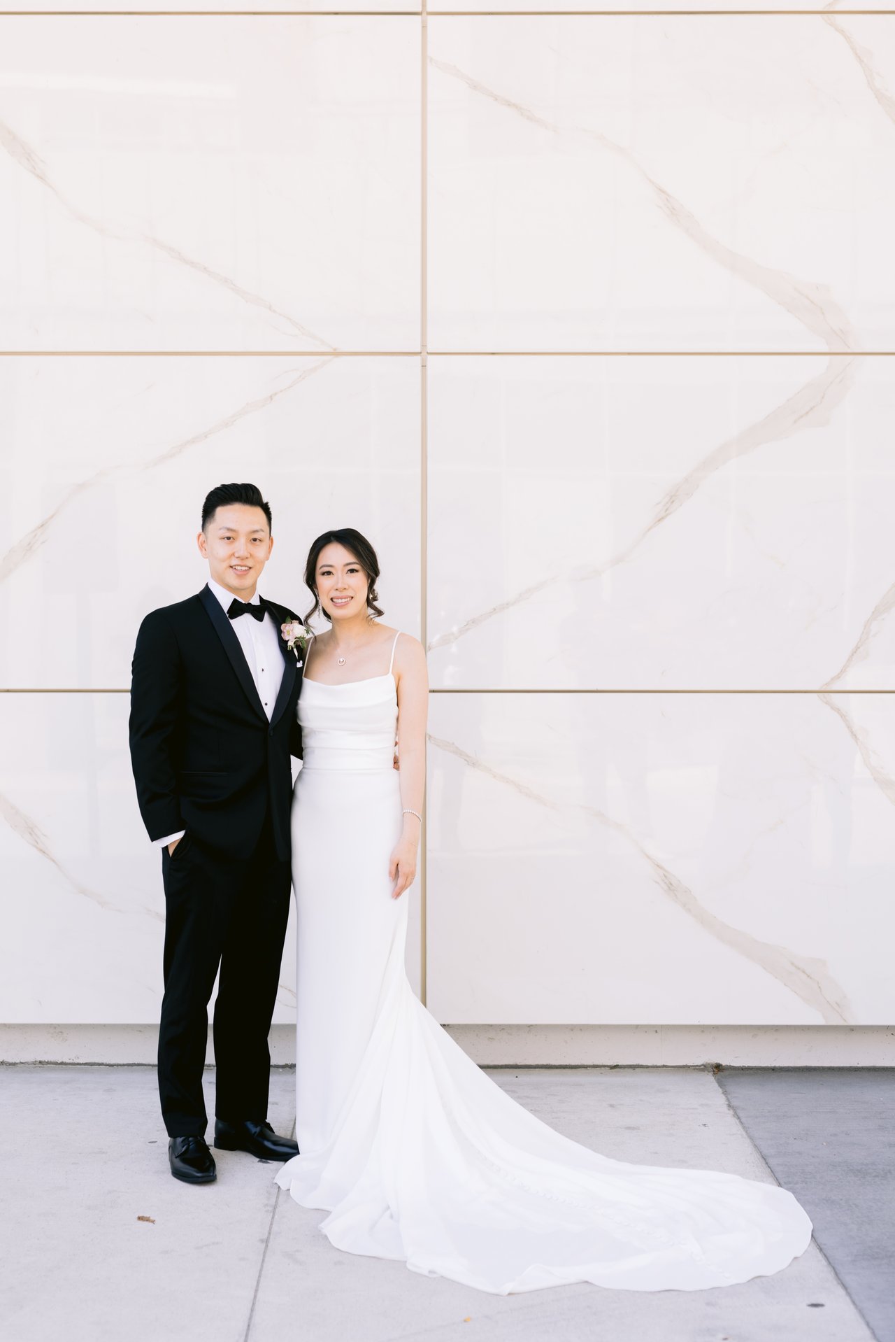 Katie and Harry against the marble wall