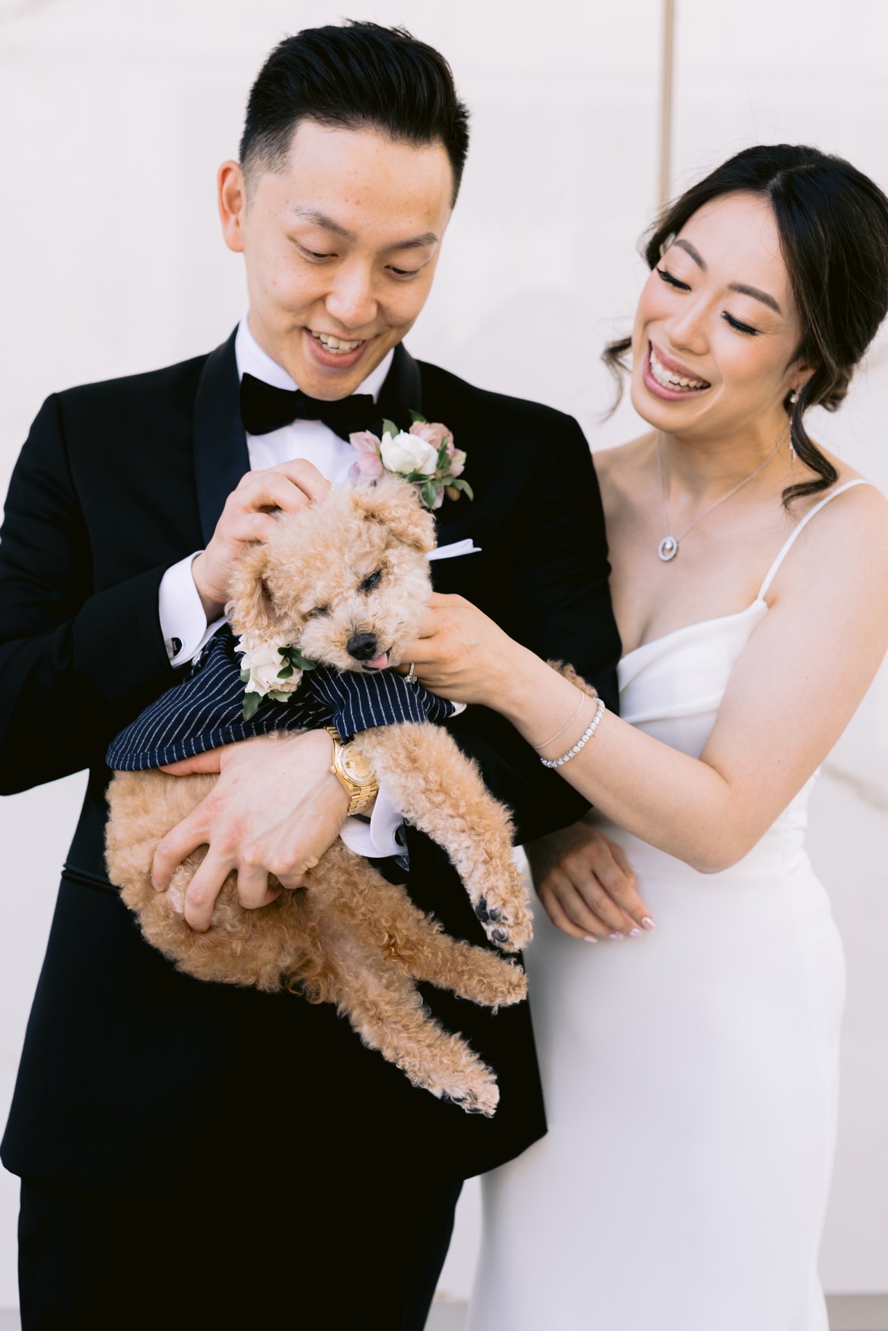 The two of them holding their dog