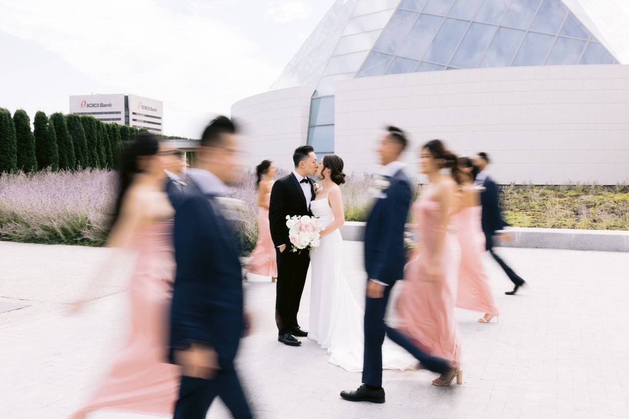 The wedding party crossing the plaza, mid-stride