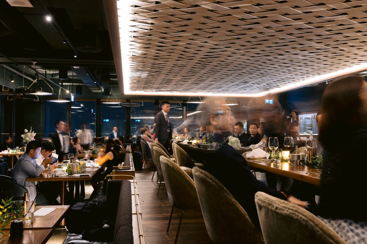 The room through dinner, chandeliers above