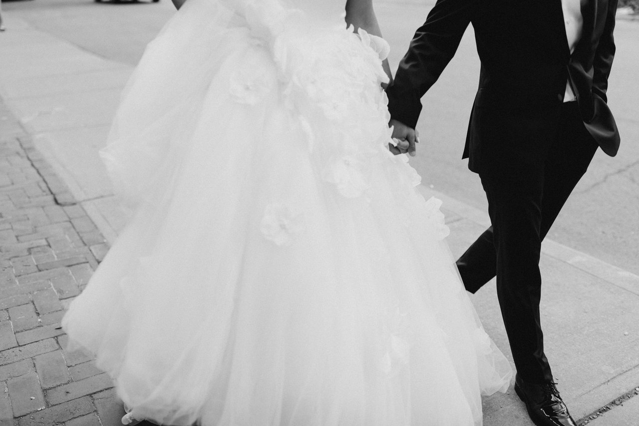 Hand in hand, the dress trailing