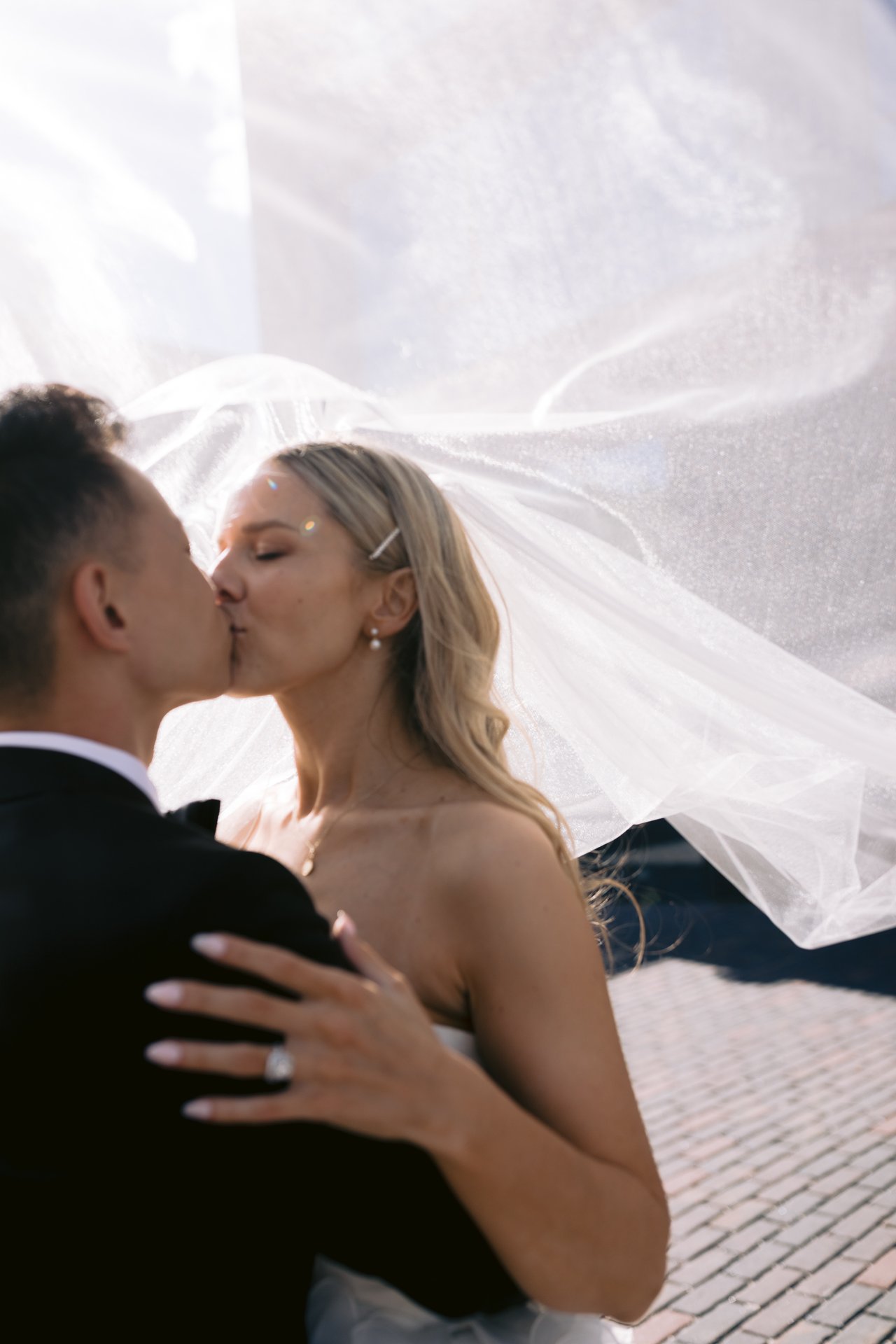 Magda and Terrence, a kiss beneath the veil