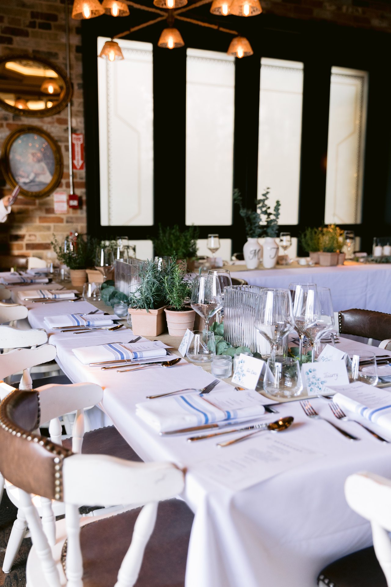The table set at Cluny, candles and greenery