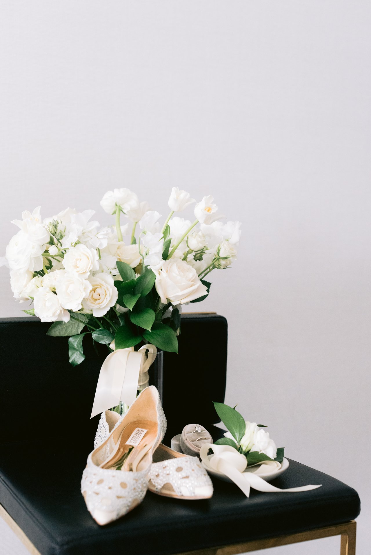 White florals and the heels on a bench