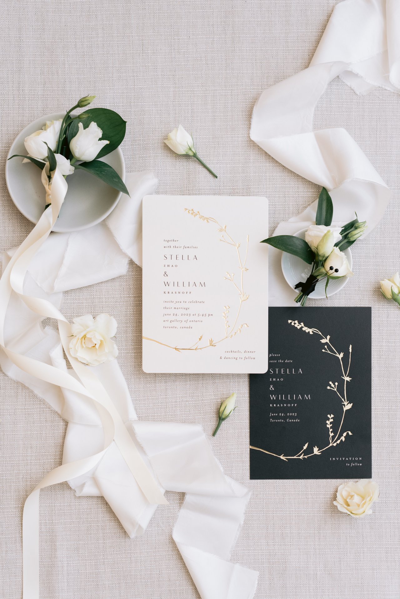 The invitation suite with ribbon and boutonnieres