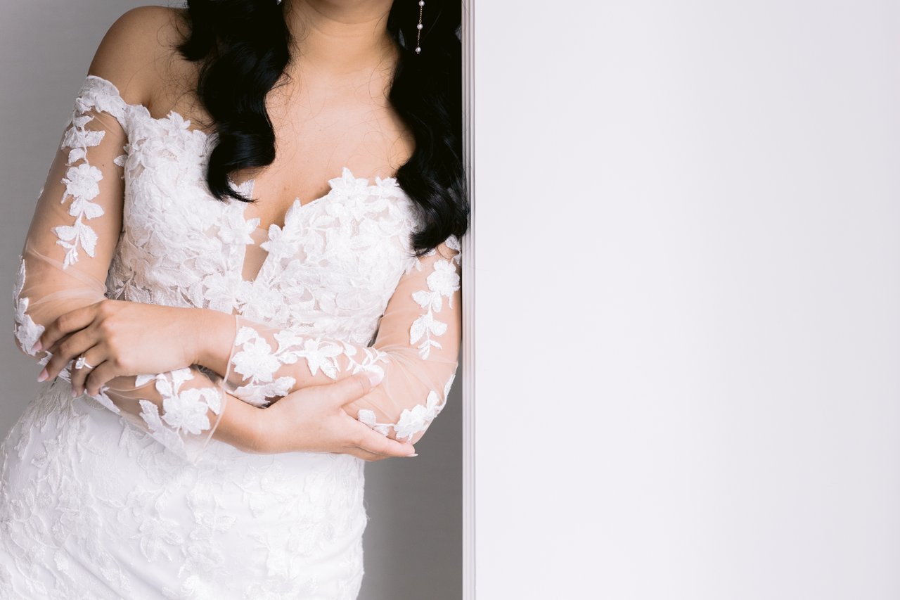 The off-shoulder lace, arms crossed
