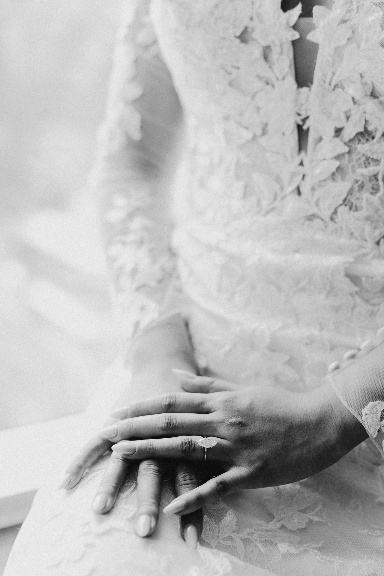Hands and the ring, in black and white