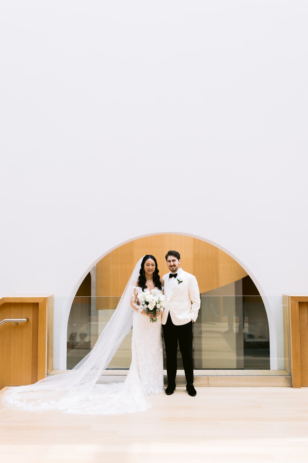 Stella and Will under the wood arch at the Art Gallery of Ontario