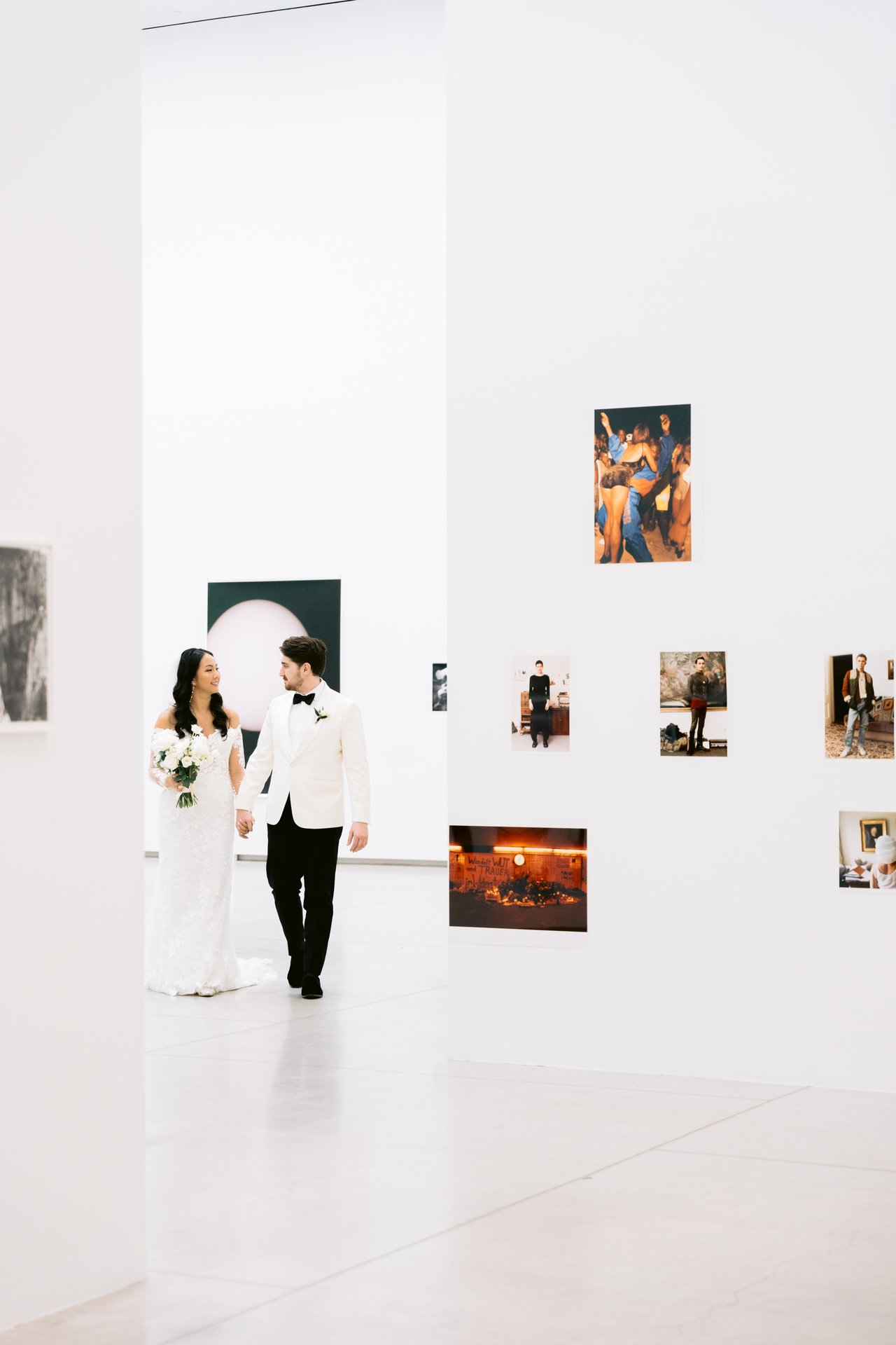 In the modern gallery, paintings on the walls