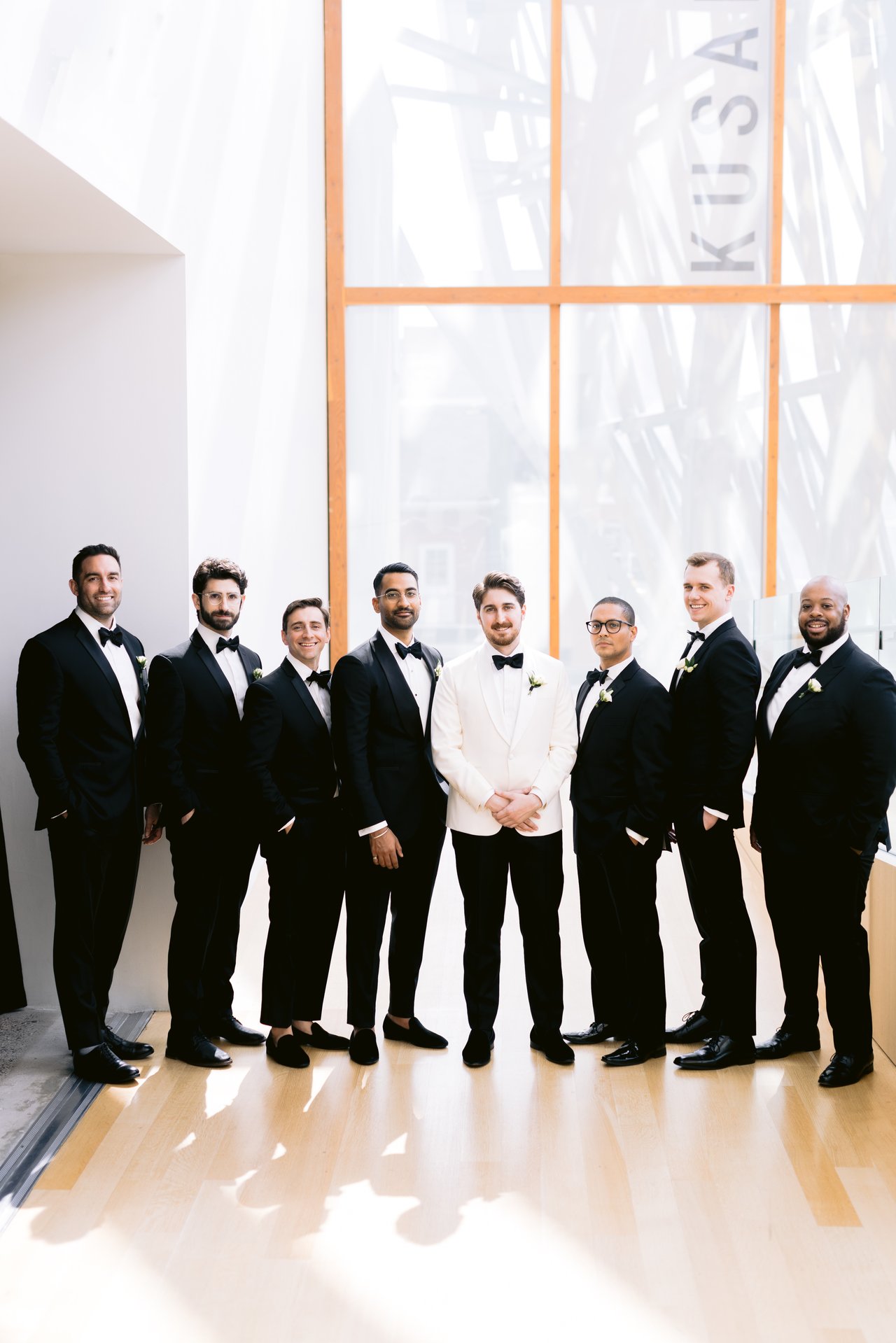 The groomsmen in black tie