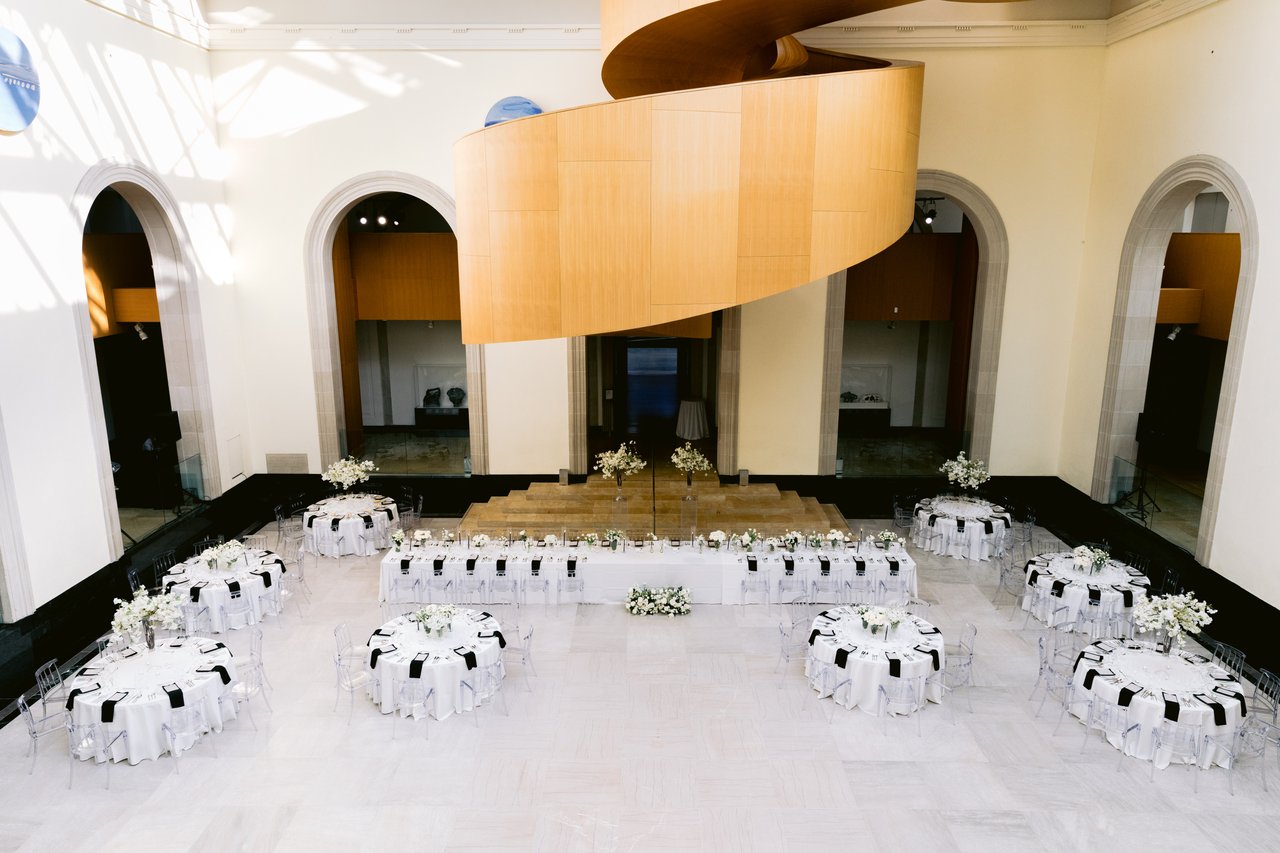 The tables set beneath the arches