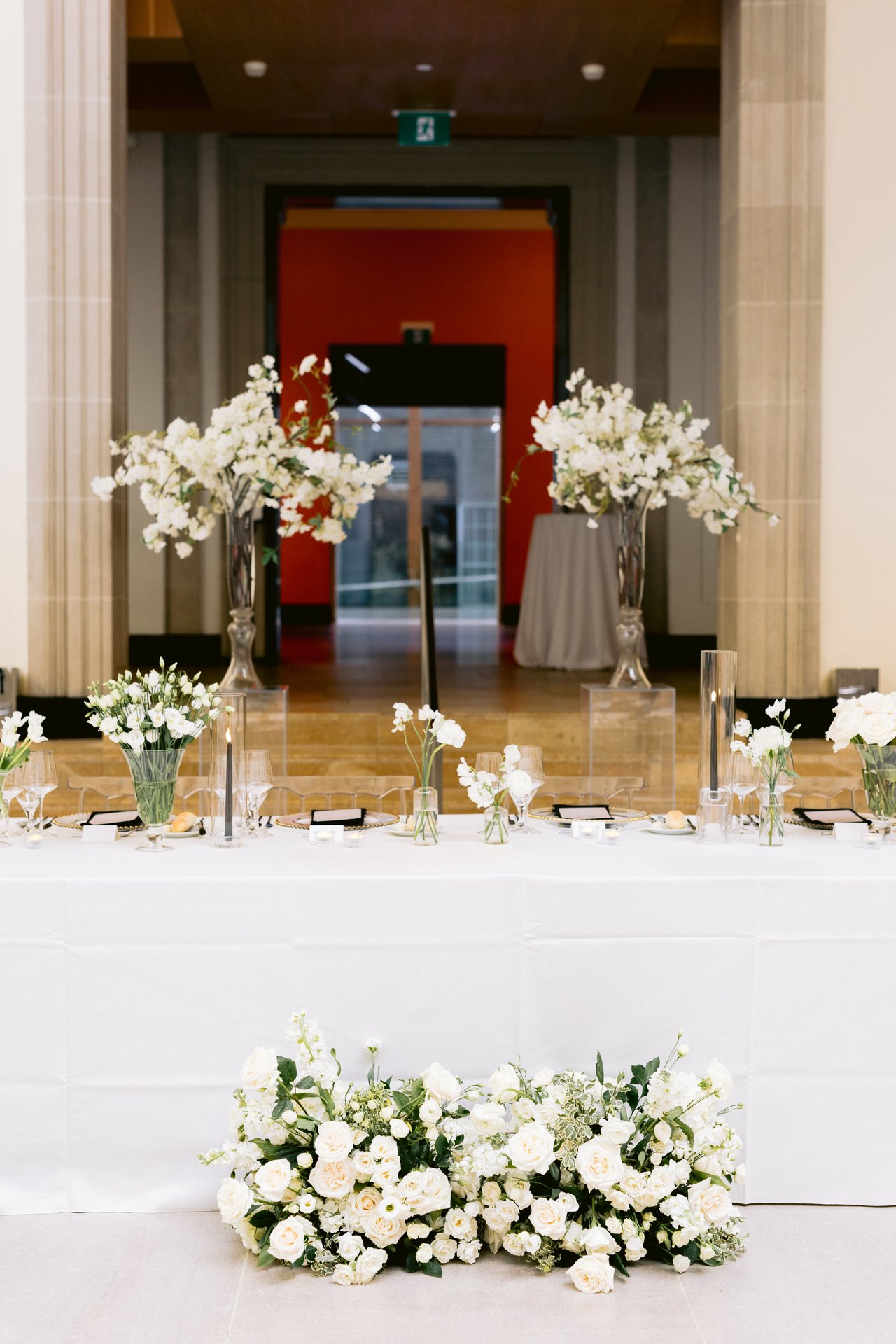The head table against the red wall