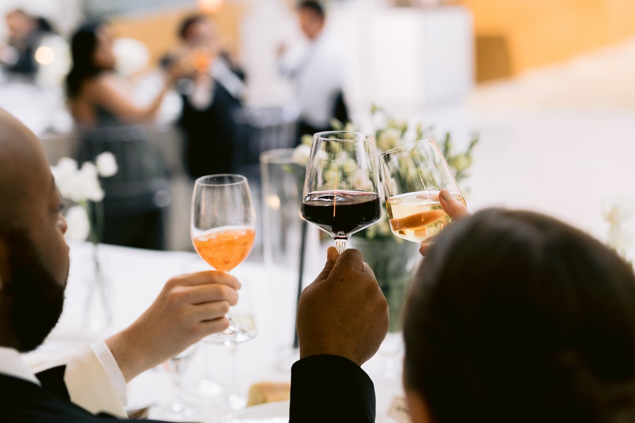 A toast, glasses raised