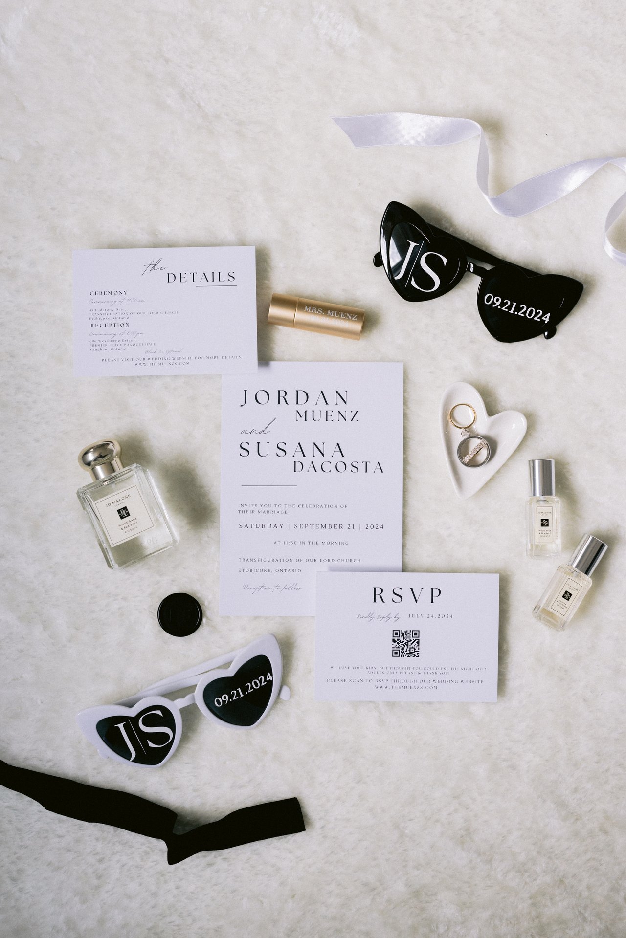 The invitation suite with perfume and monogram hearts