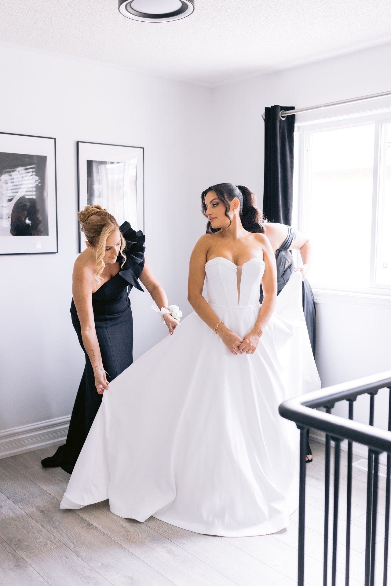 Susana being helped into her gown