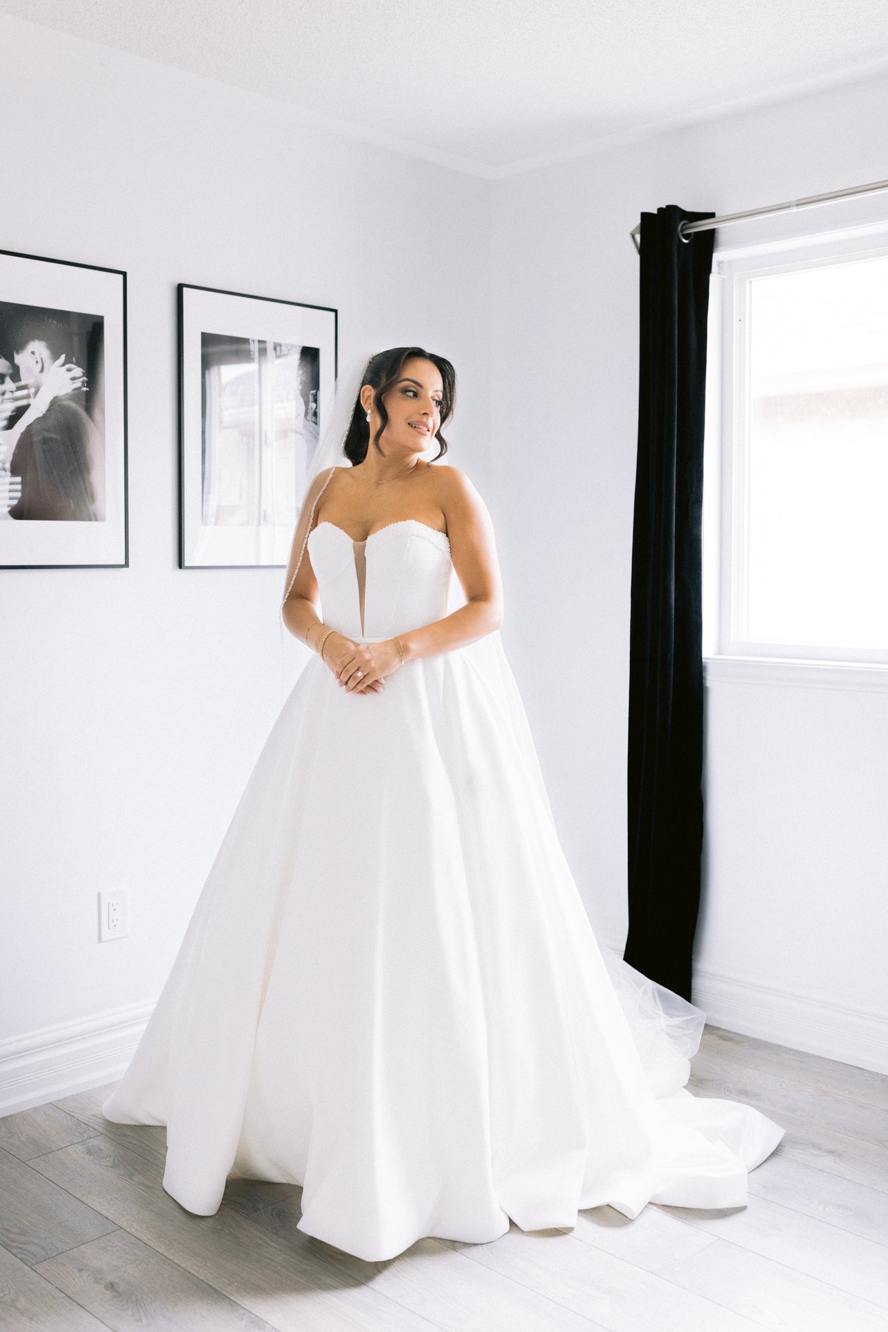 Susana in her gown by the window