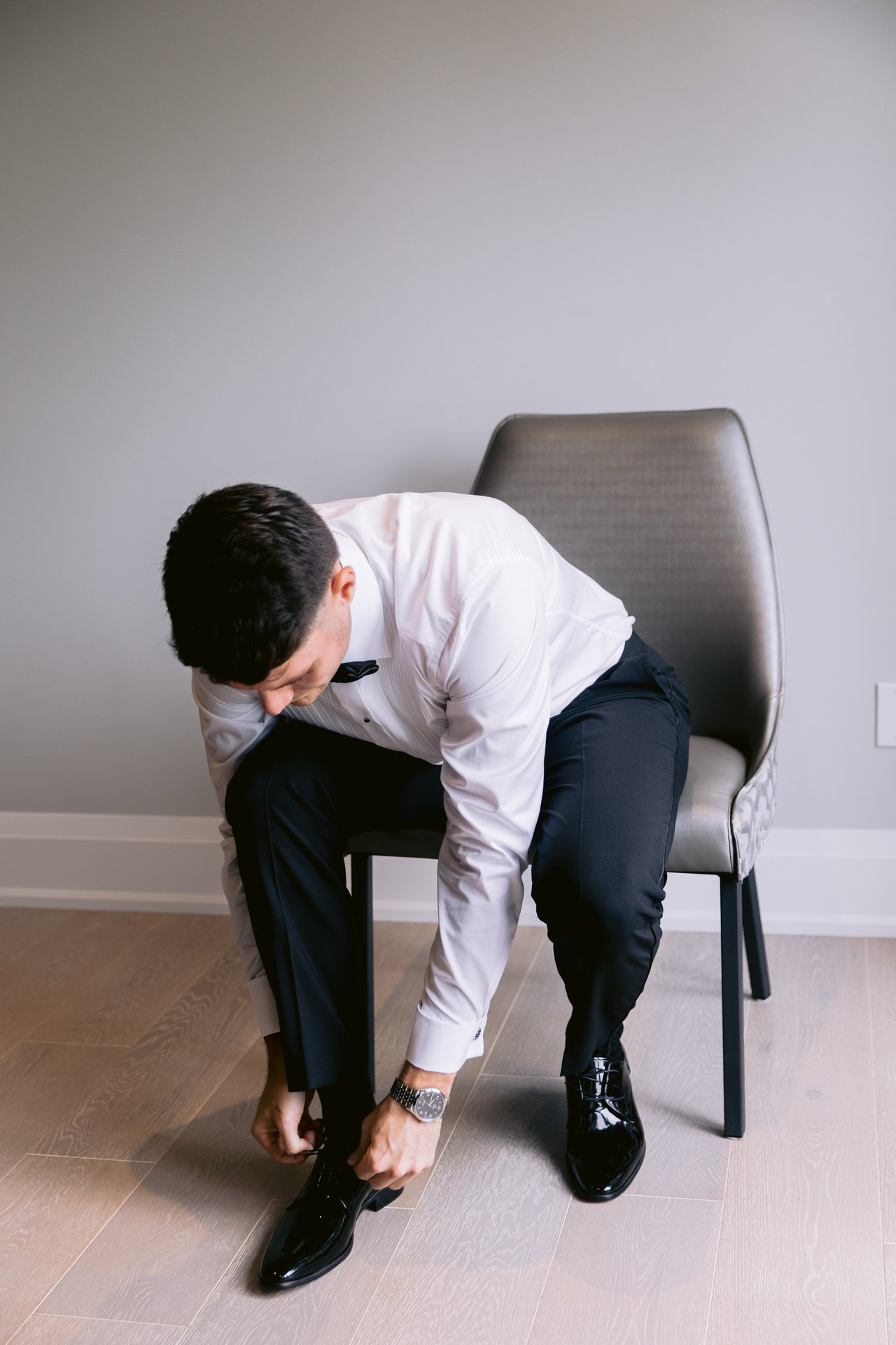 Putting on his shoes