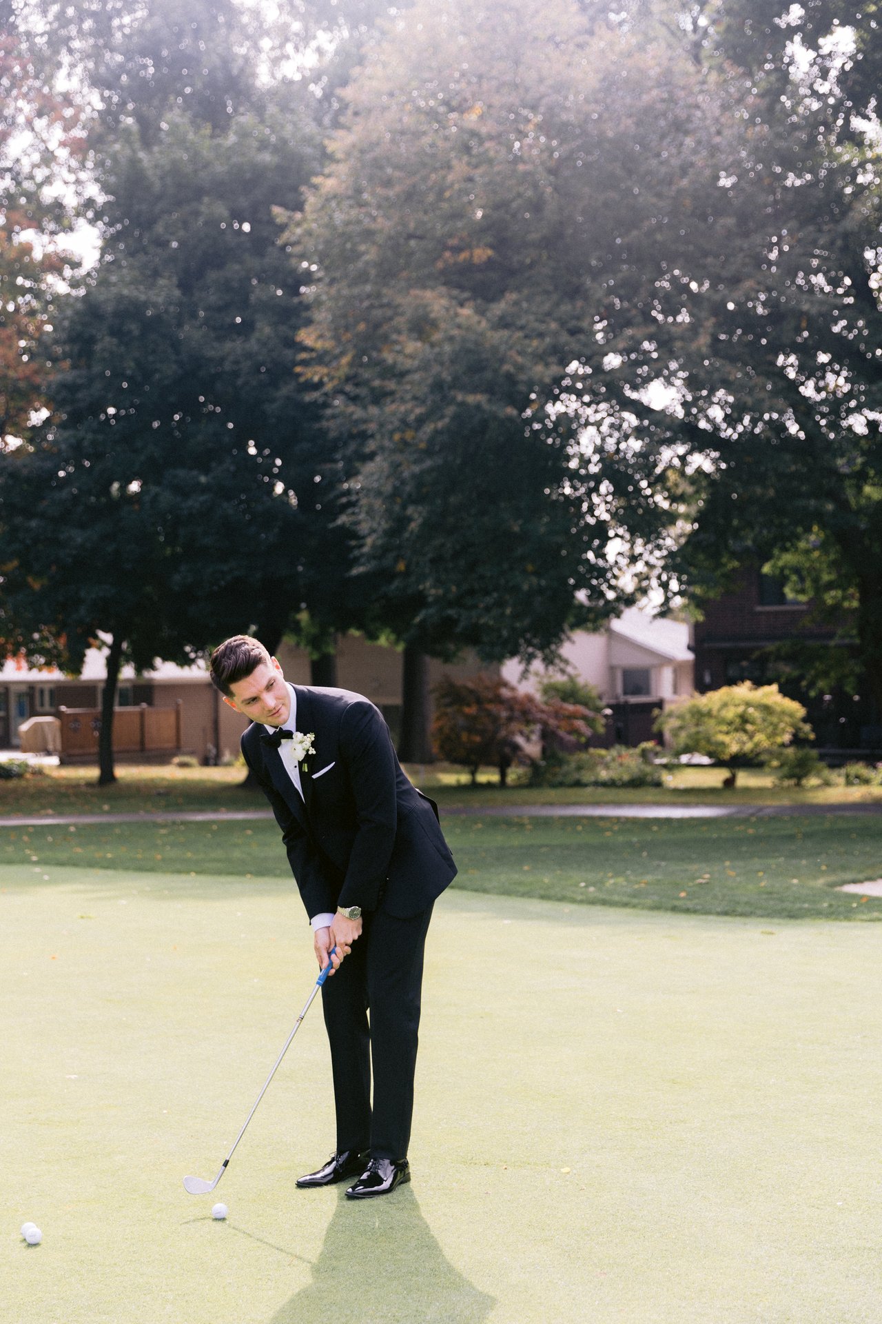 A putt on the green before the suit