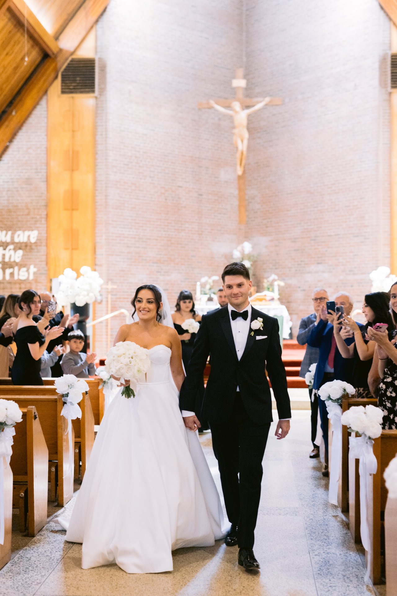 Married, back down the aisle through the petals