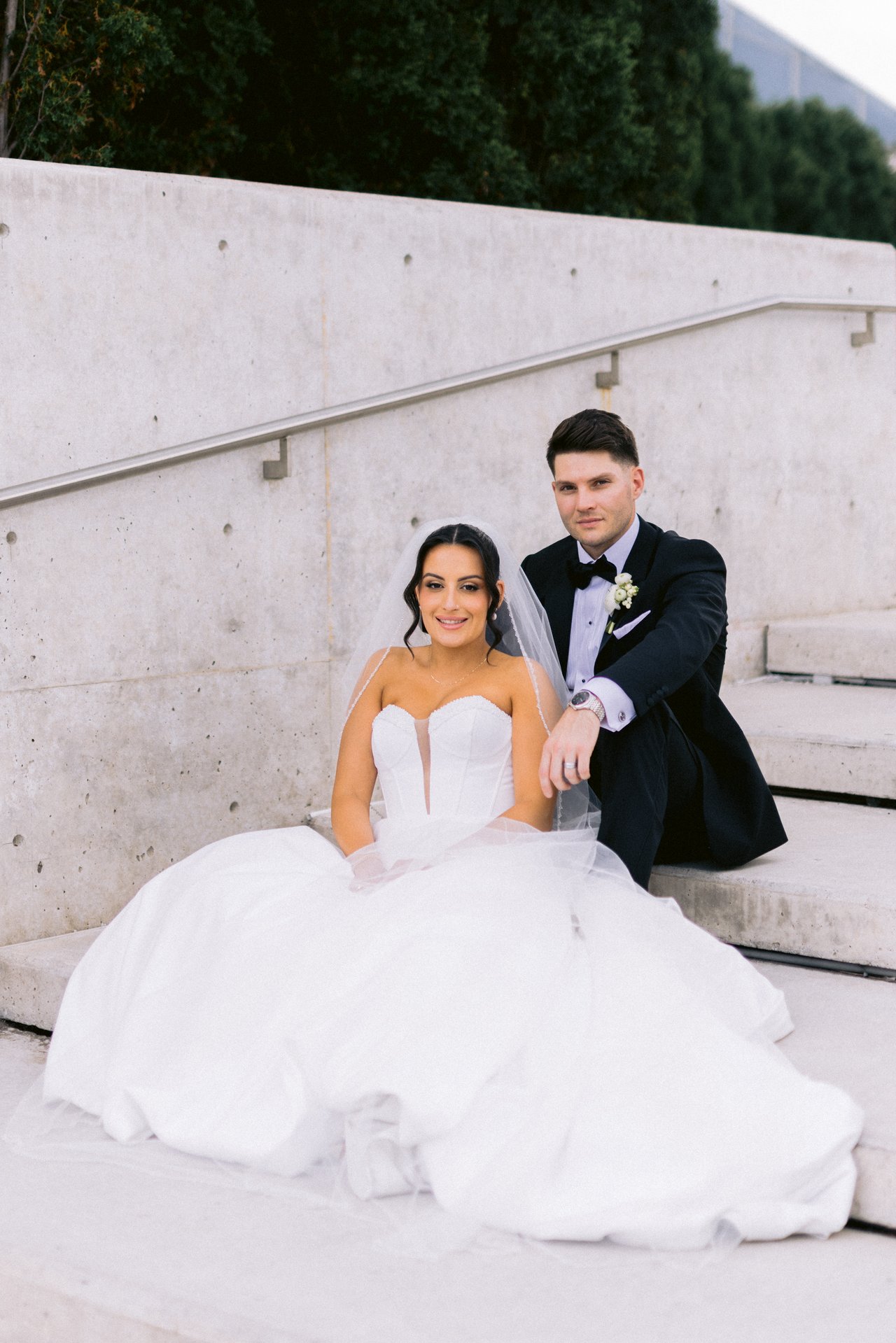 Susana and Jordan on the steps at the Aga Khan Museum