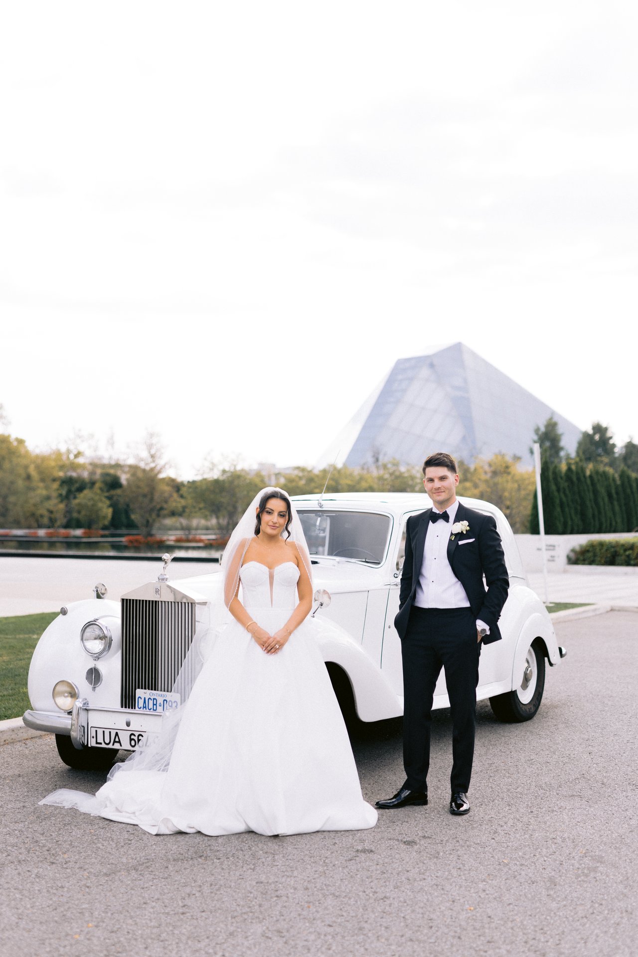 With the Rolls and the pyramid behind
