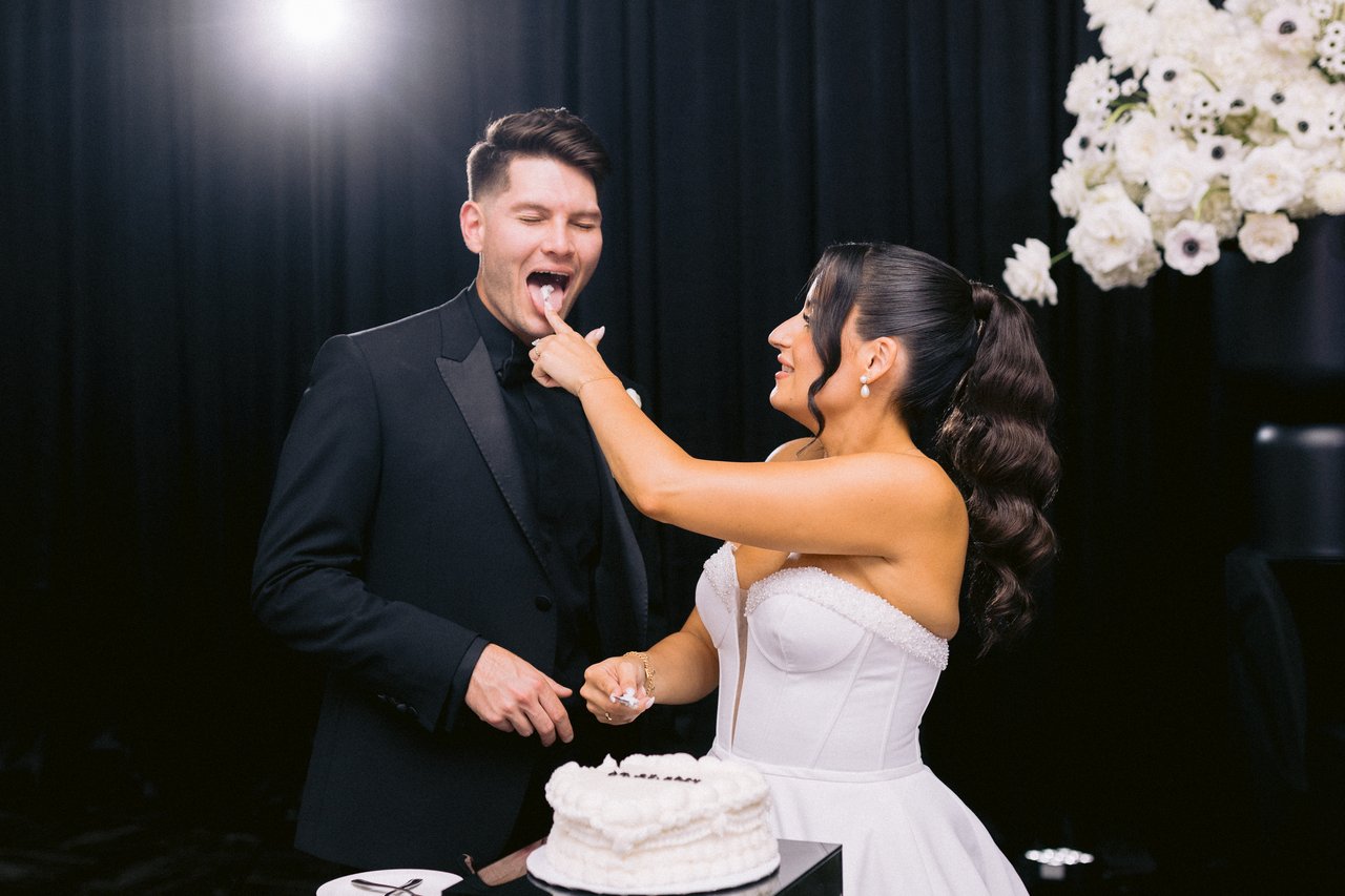 A bite of cake, laughing