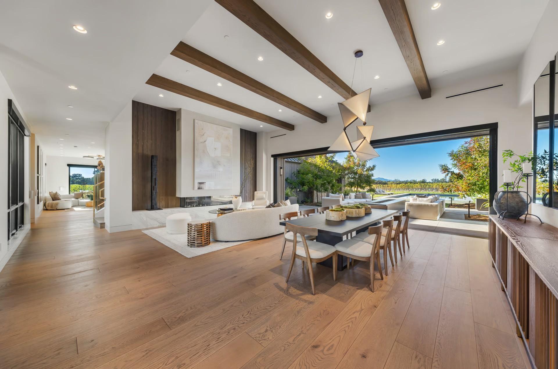 Open-plan dining and living space with vineyard views