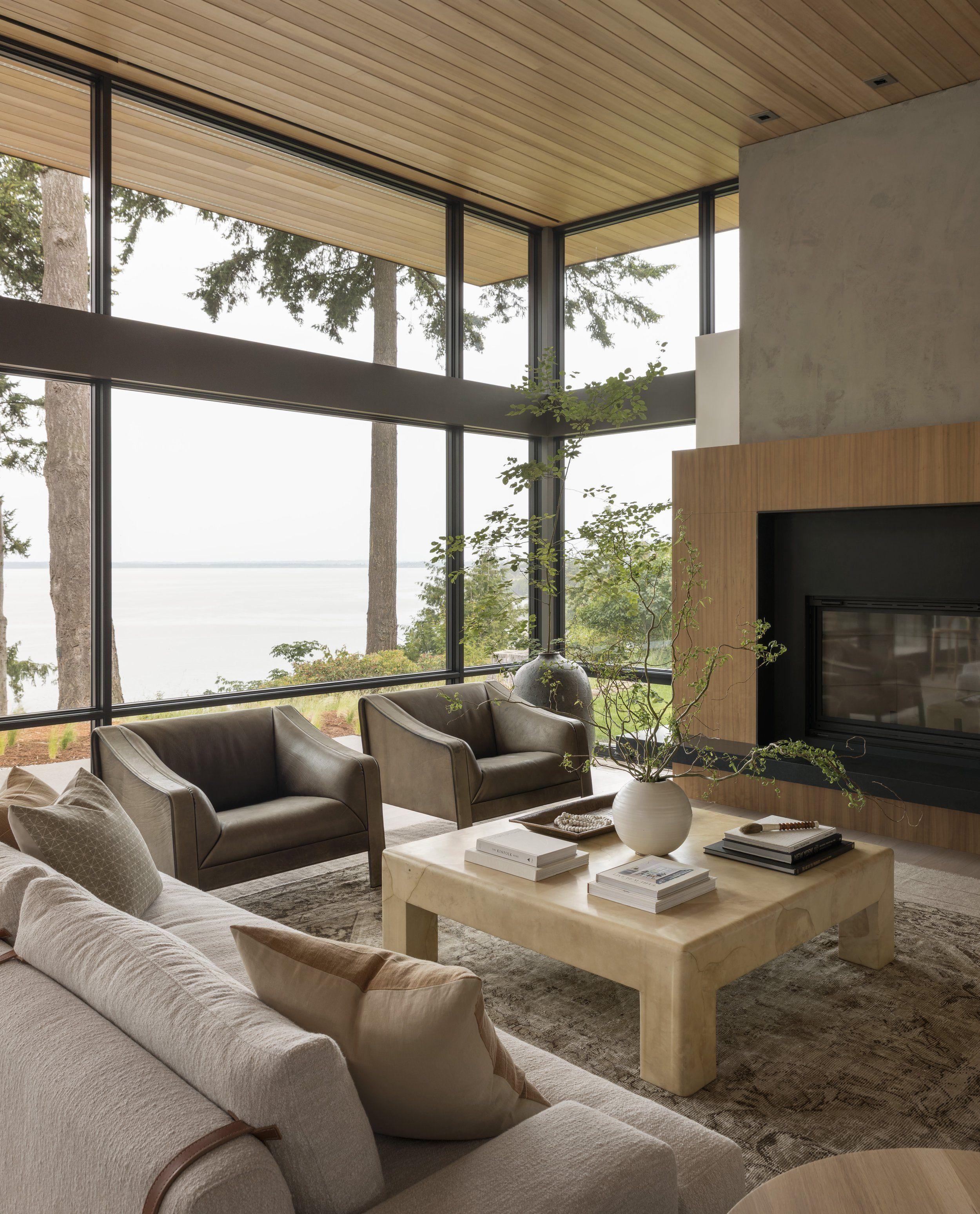 Open living room with floor-to-ceiling windows over the water