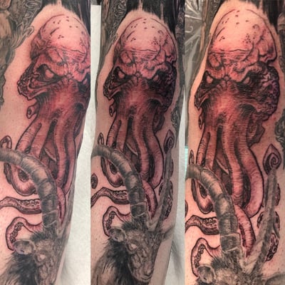 A dark and graphic tattoo featuring an octopus intertwined with a goat skull on the forearm, done in a blackwork style with mixed color highlights — by Sandra Price, los angeles