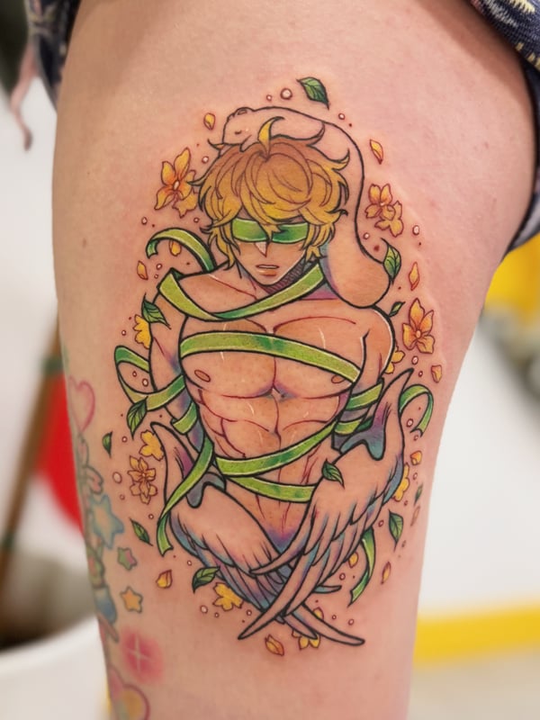 A colorful anime-style tattoo on the thigh featuring a muscular figure wrapped in green ribbons with flowers and a snake, showcasing vibrant colors and detailed linework — by Tweetwee, west covina, ca
