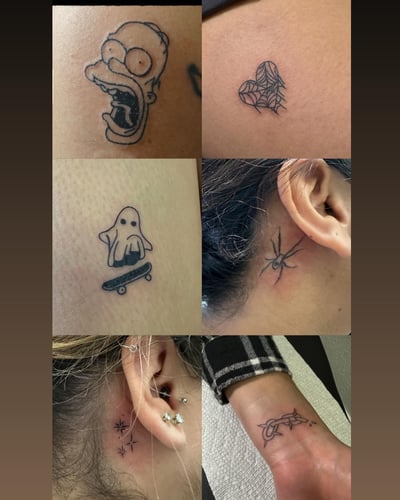 A collection of small minimalist tattoos including a spider, heart, and stars in black and grey linework — by Maddie Ramirez, los angeles