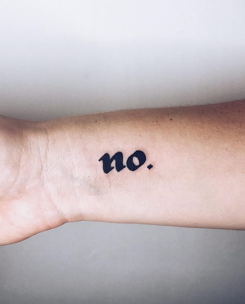 A minimalist black script lettering tattoo on the wrist reading 'no.' — by Level tattoo, los angeles